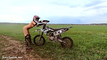 Play Naked woman riding a Dirt Bike